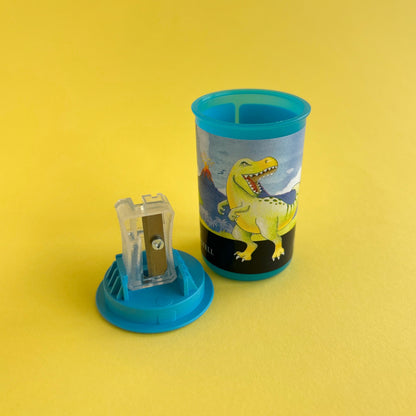 Tajalápiz con depósito dinosaurio x unidad - Verde y Azul